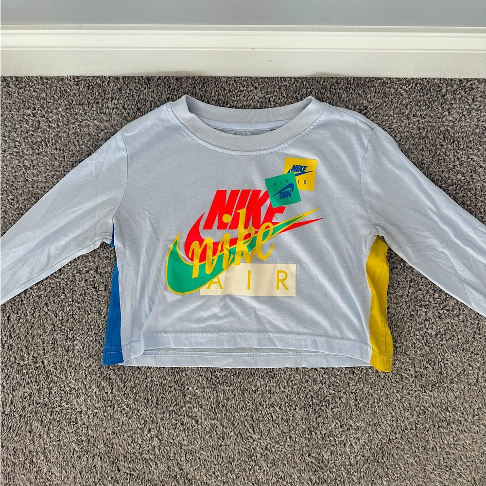 Nike Women’s Logo Long Sleeve Cropped Shirt in Blue/ multicolor, size S